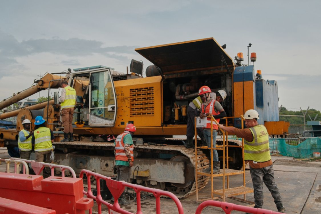 Workers actively working at a busy construction site during an ongoing development project