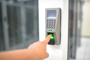 A visitor using a finger scanner for security clearance.